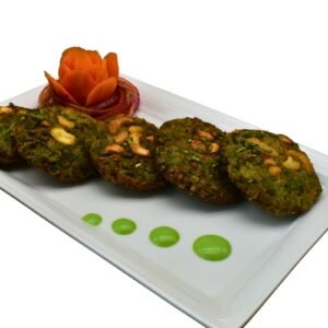 Hara Bhara Kebab served hot with green chutney and salad – a crispy, flavorful Indian vegetarian starter.