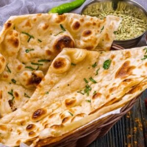 Tandoori Butter Roti fresh from the clay oven, brushed with butter and served hot – soft, smoky Indian flatbread.