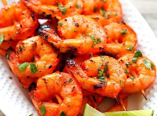 Tandoori Prawns – Juicy, marinated prawns grilled to perfection with smoky tandoori spices.