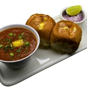 Pav Bhaji served with buttery pav bread and spicy mashed vegetable curry topped with butter and onions.